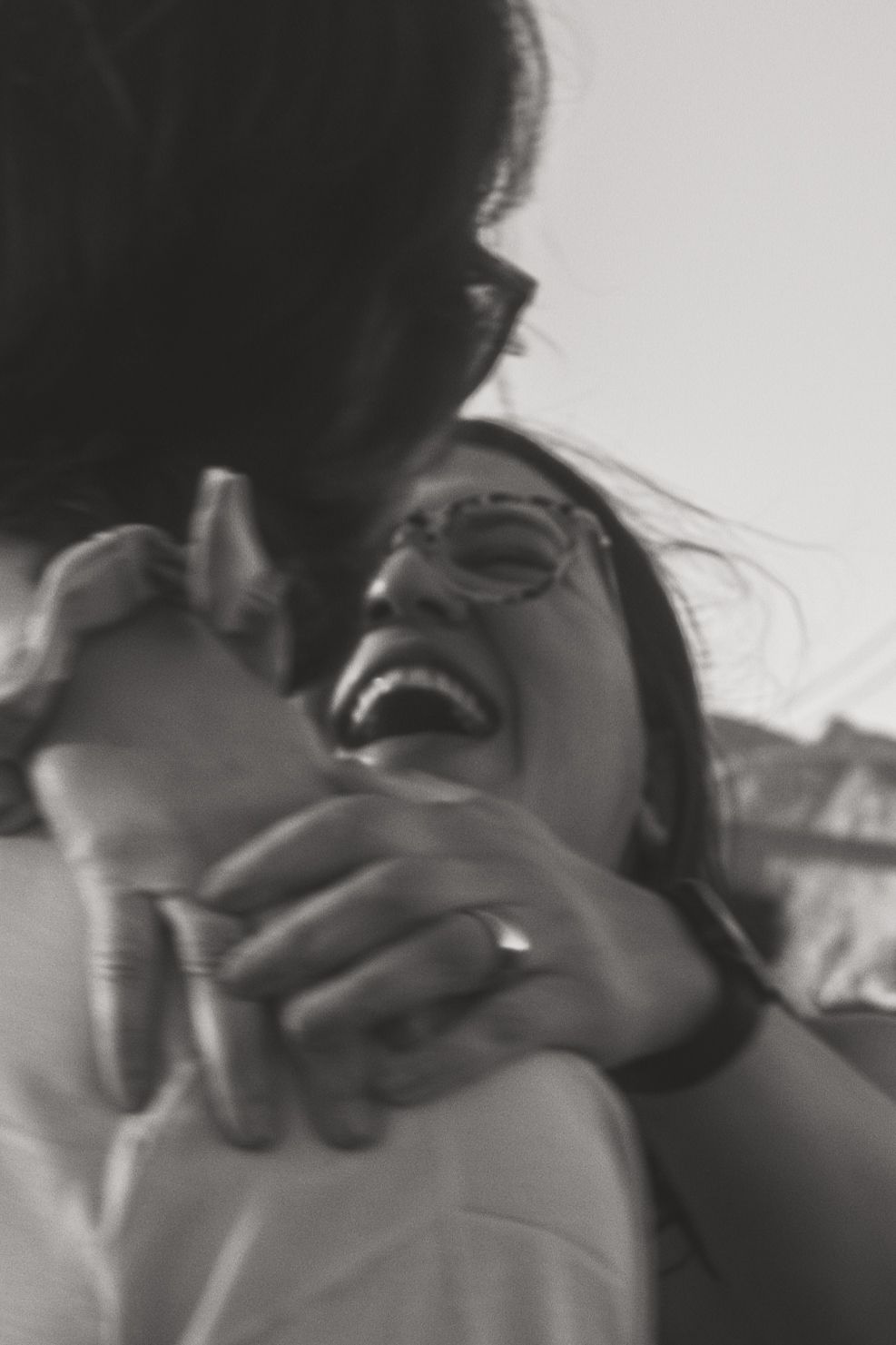 Black and white candid photo sequence capturing laughter and joy.