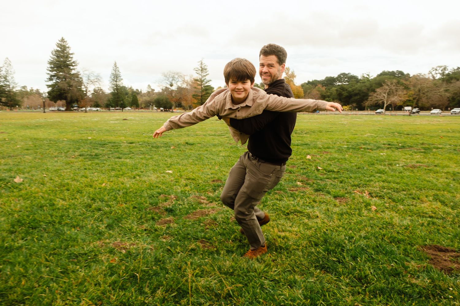 Playful poses captured in sequence on sunny grassy field.