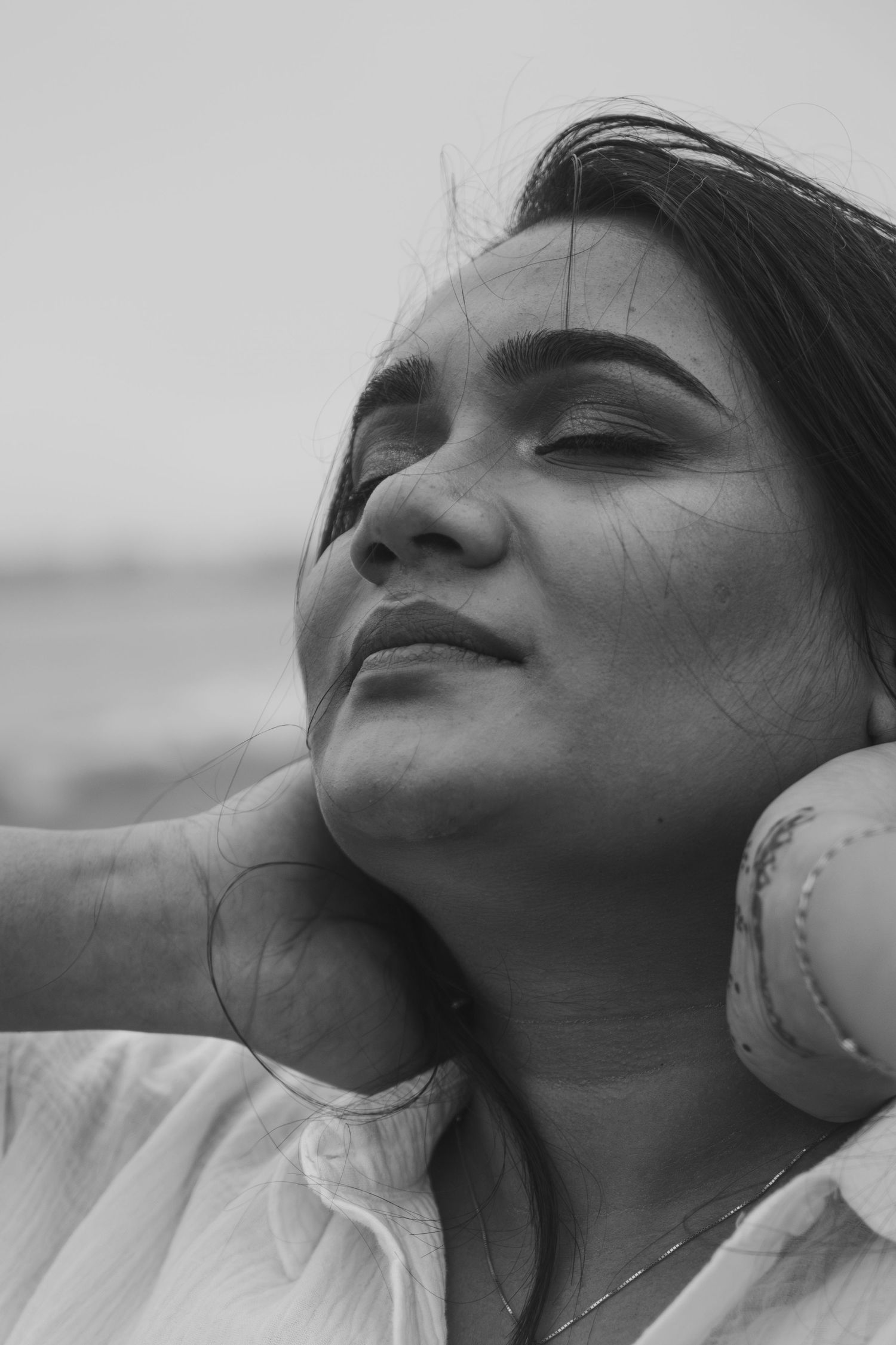 Close-up black and white portraits showing emotional expressions.