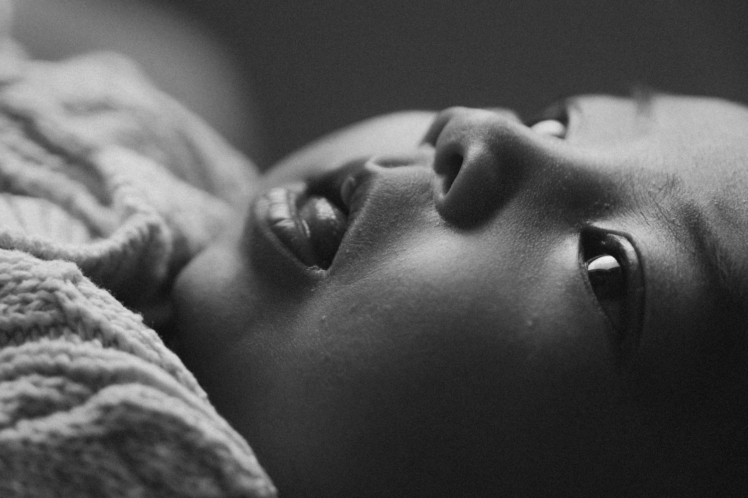 A collection of black and white close-up profile portraits arranged in a horizontal row.