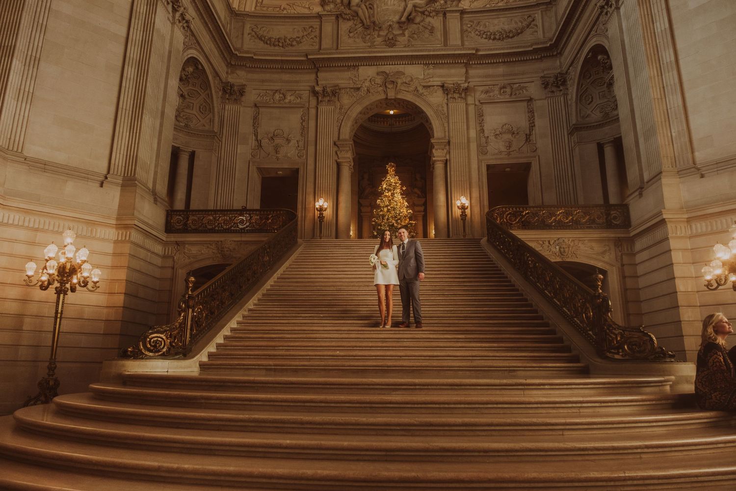 Wide view of City Hall's grand staircase with ornate ceiling and classical details.