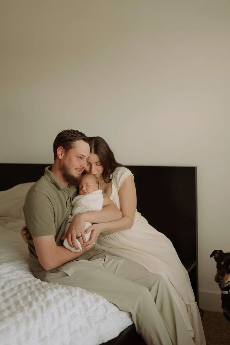 A tender family moment captured in a series of intimate black and white photographs on a bed.
