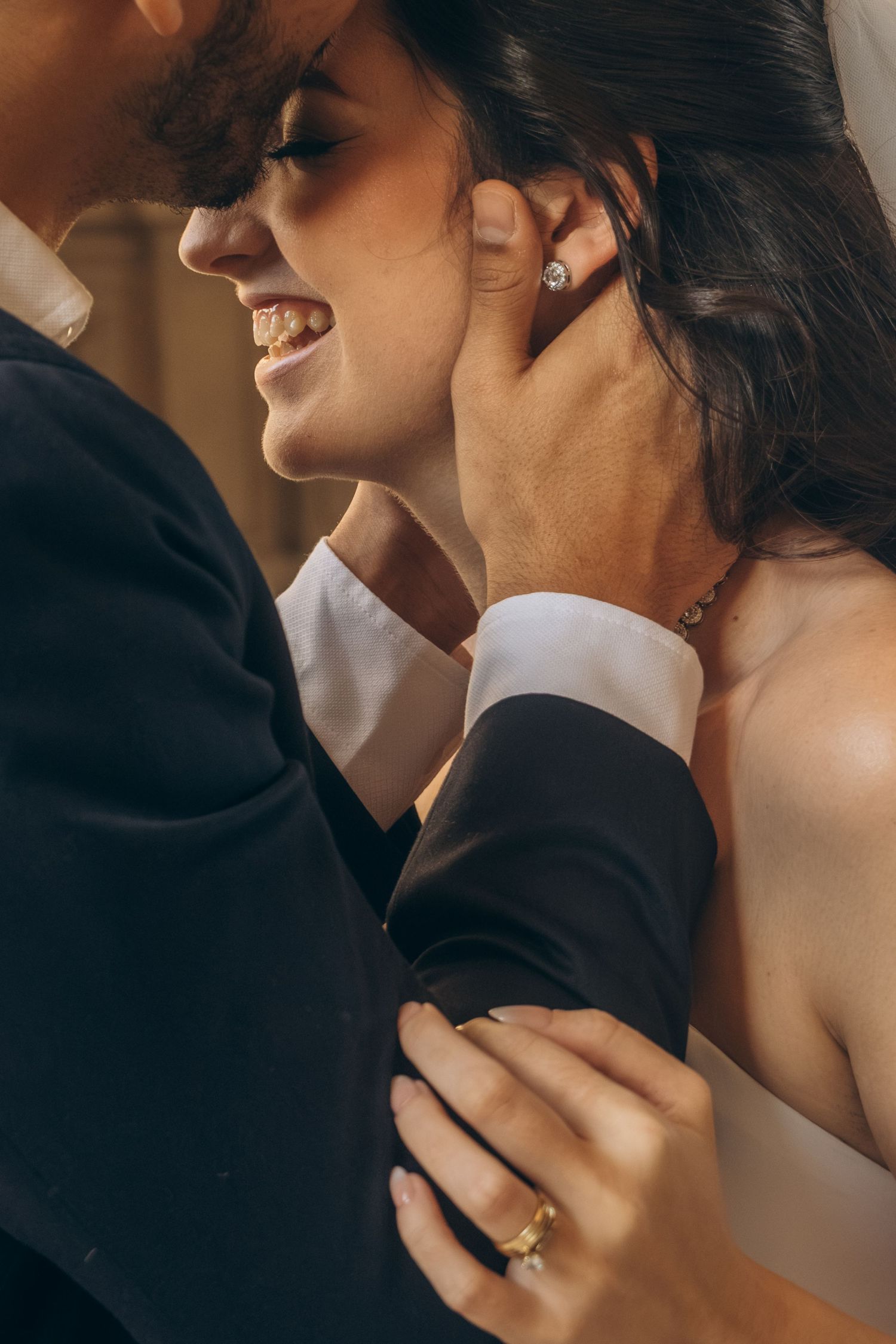 Close-up wedding portrait showing joyful expressions and intimate moments.
