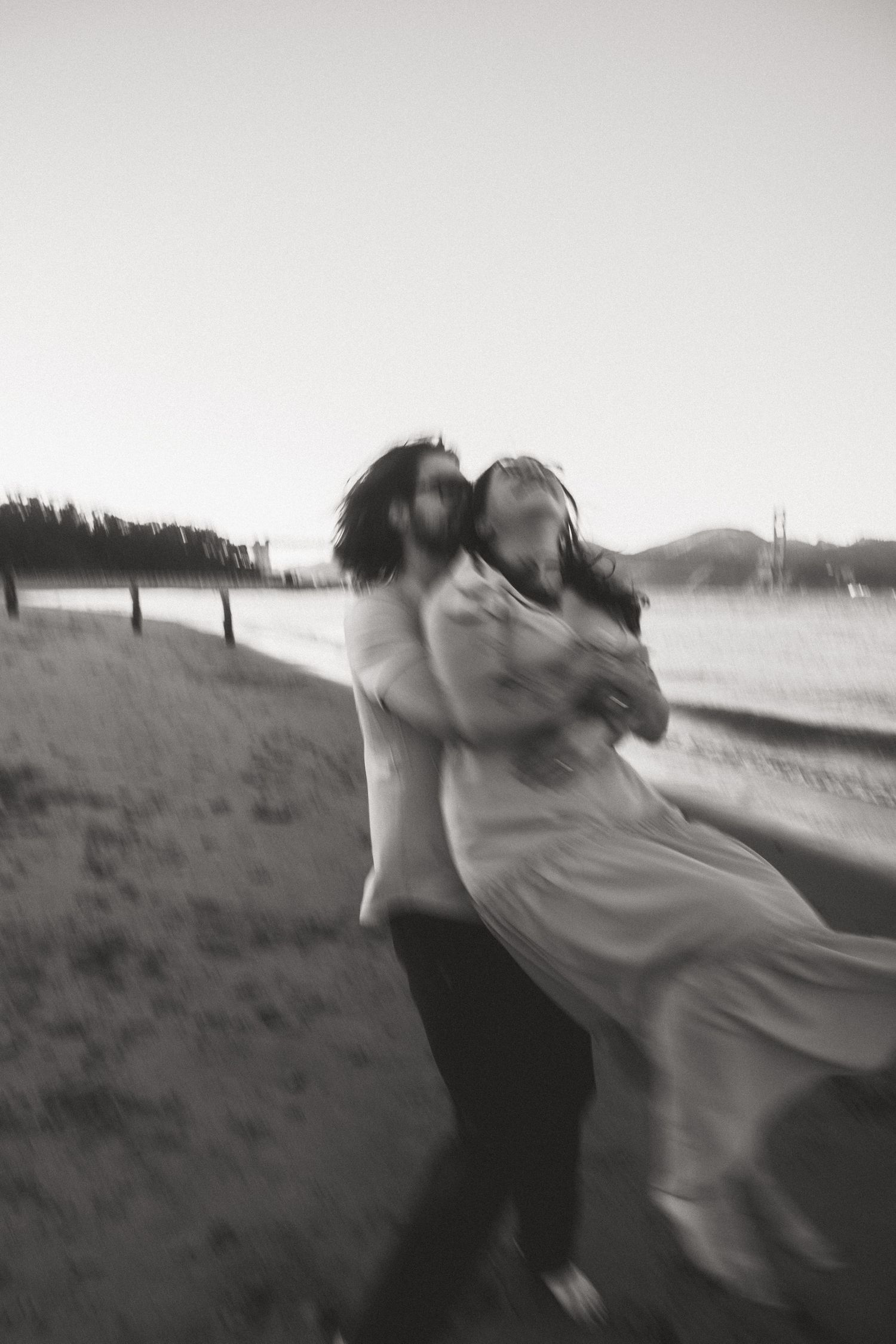 Black and white artistic motion blur photograph on a hillside.