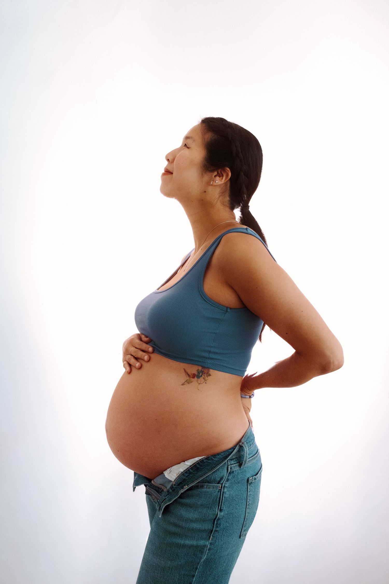Side view maternity photos showing pregnancy progression against white background.