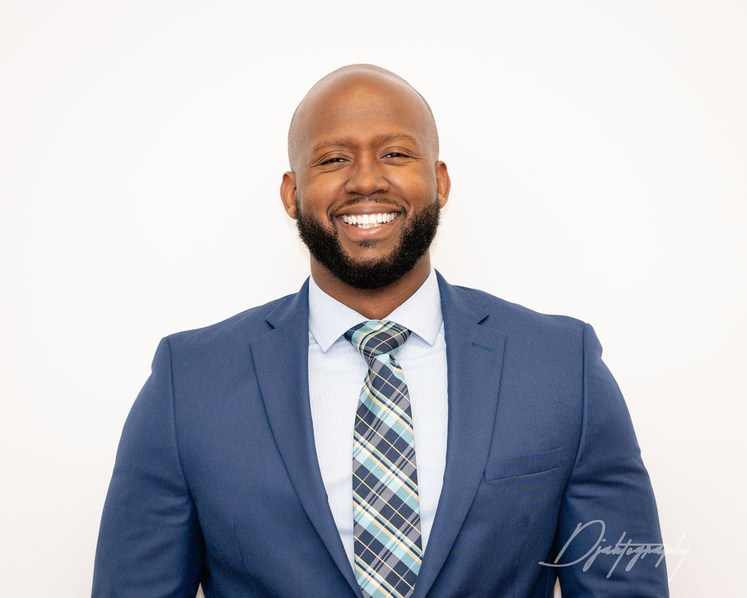 Professional headshot South Florida businessman in blue suit clean modern corporate portrait.