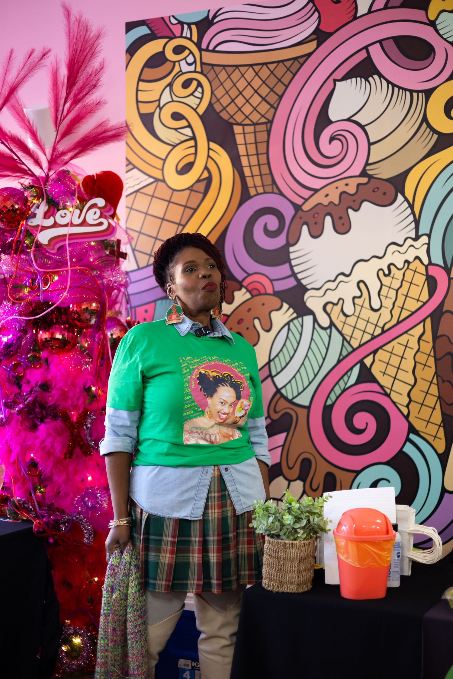 Colorful street art mural featuring ice cream cones, swirls and abstract designs in pink, yellow and brown tones.