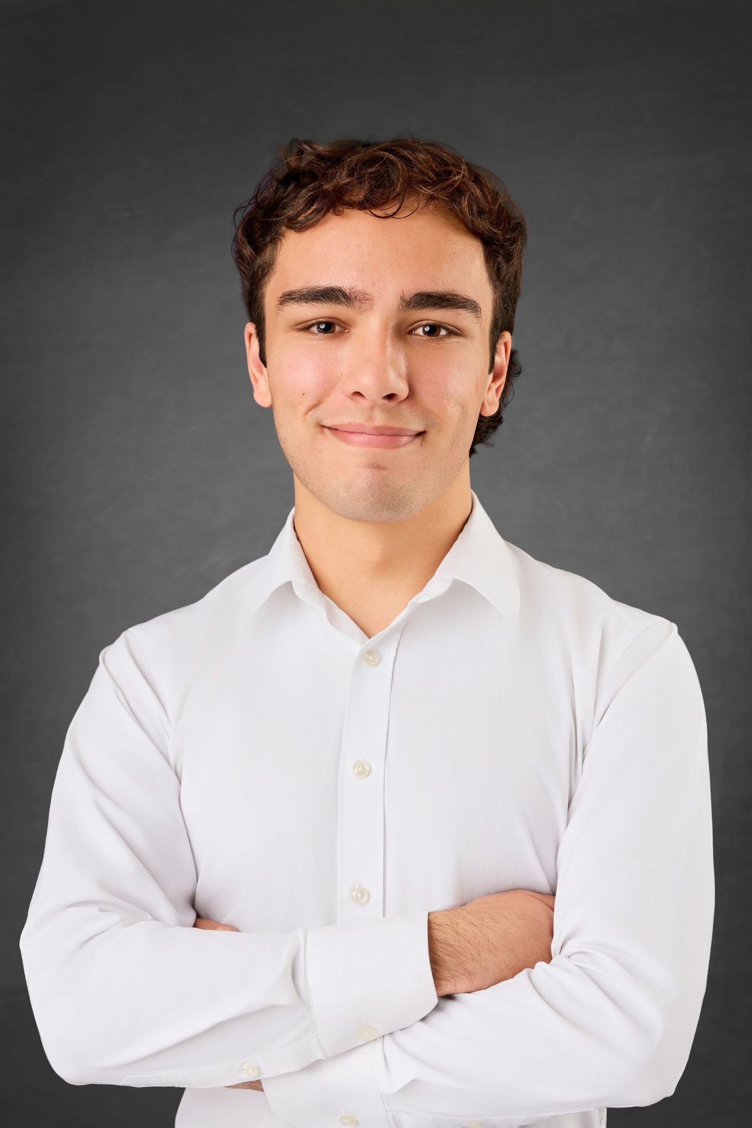 A series of studio portraits showing someone in a white button-down shirt posing with crossed arms against a gray backdrop.