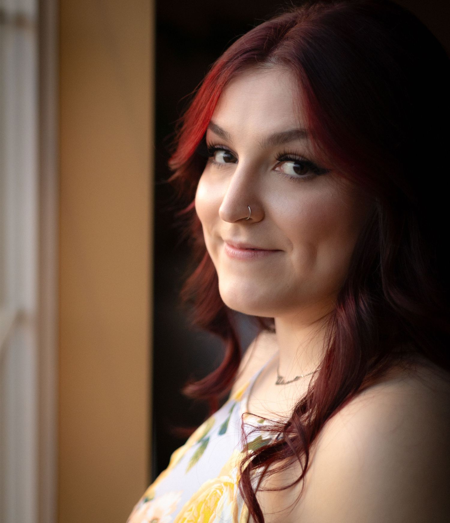 Portrait series showing a girl with red hair and dramatic lighting against a dark background.