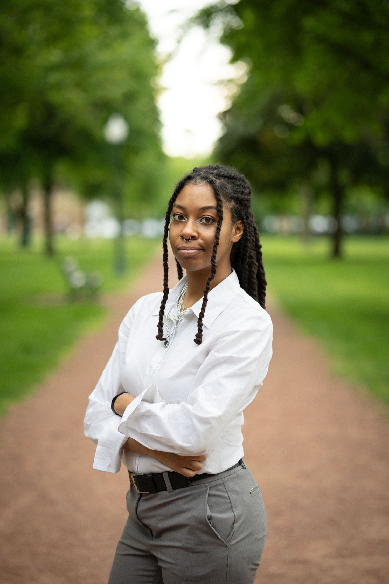 A series of portraits taken outdoors on a tree-lined path showing joyful expressions and casual poses in natural lighting.