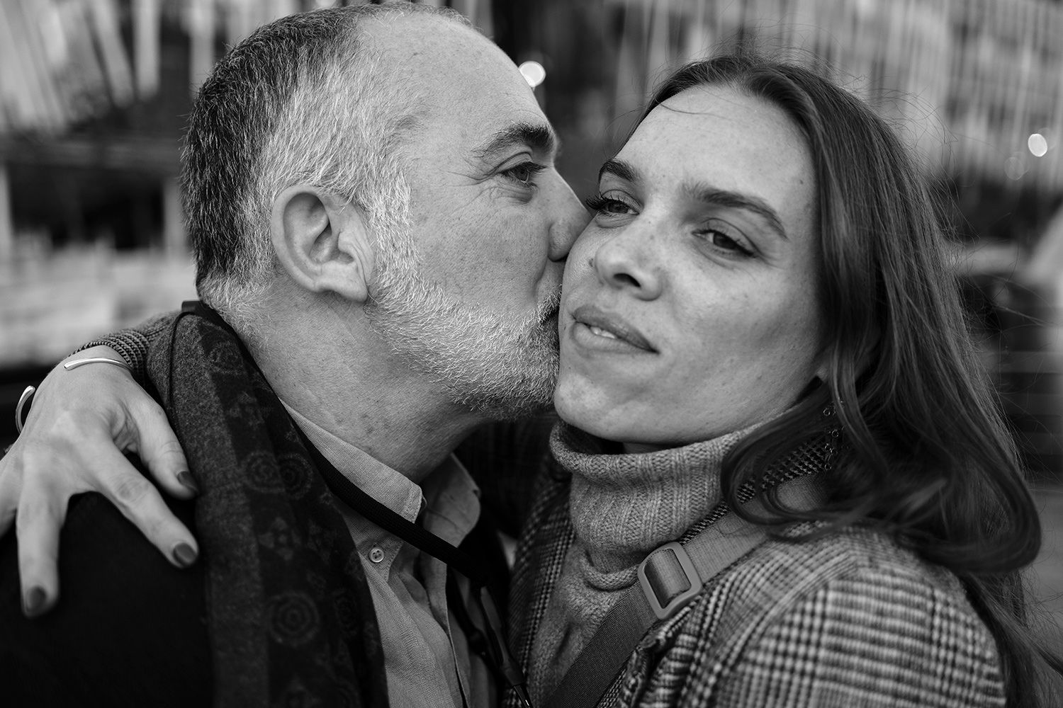 Candid black and white couple’s portrait in Sydney by Raymond Mather, natural photography capturing intimacy, laughter, and connection.