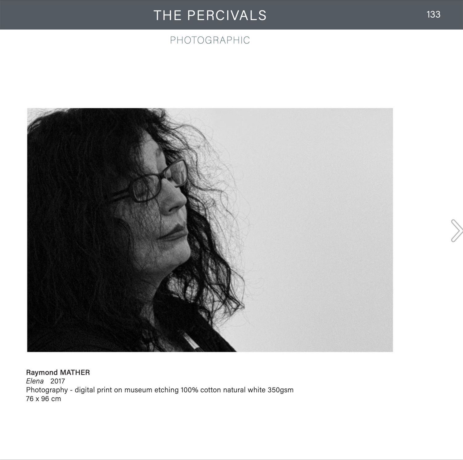 Black and white portrait photograph of a woman with curly hair and glasses by Raymond Mather, titled Elena, 2017.