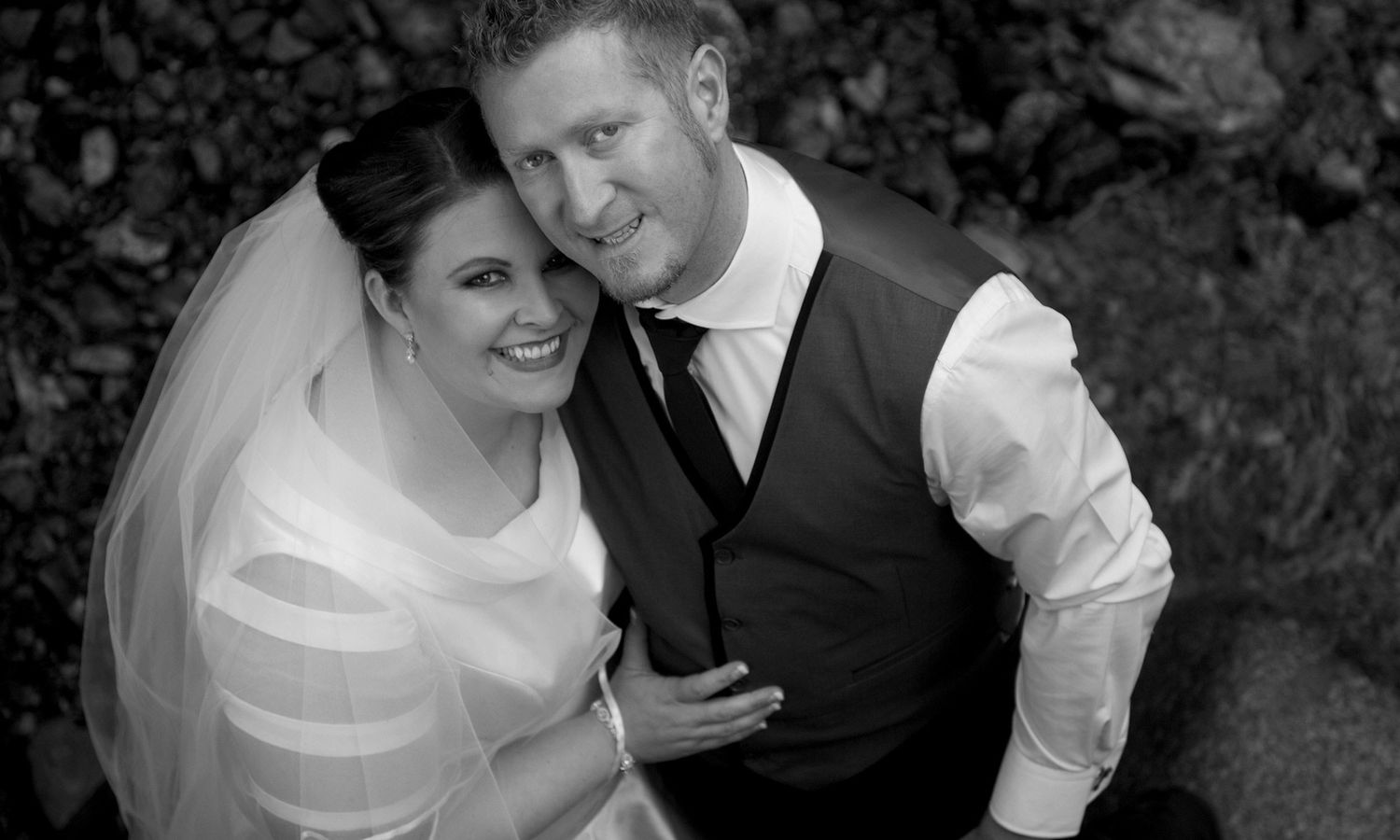 Black and white version of the couple’s portrait, highlighting soft light and timeless expression. Photo by Raymond Mather.