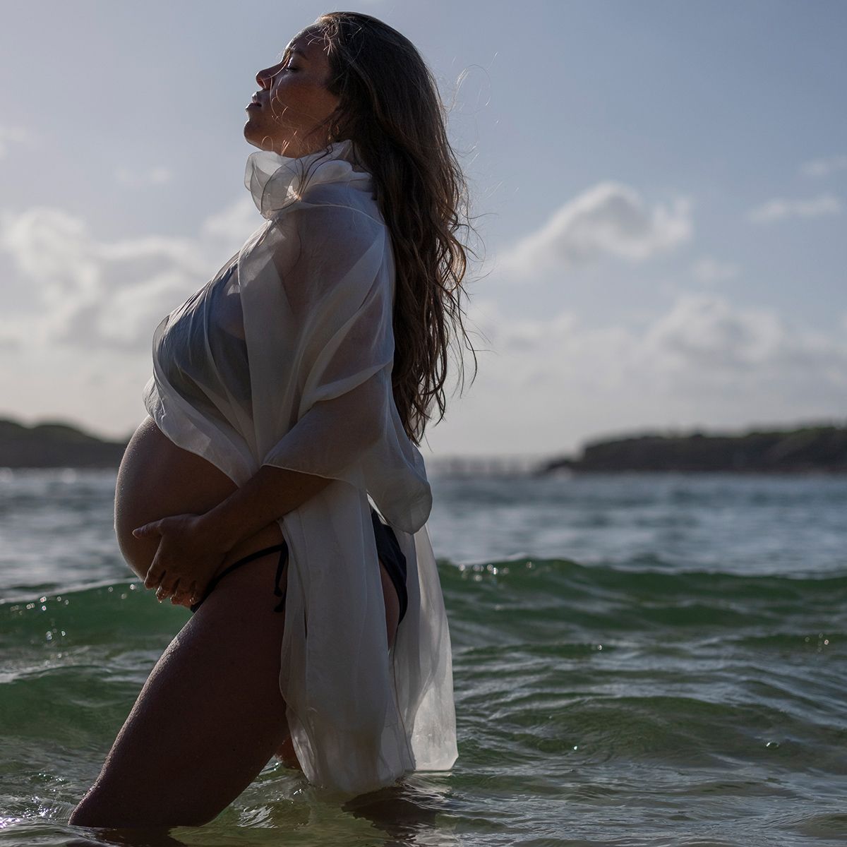 Natural maternity portrait at La Perouse by Raymond Mather, colour coastal photography capturing beauty, love, and new beginnings.