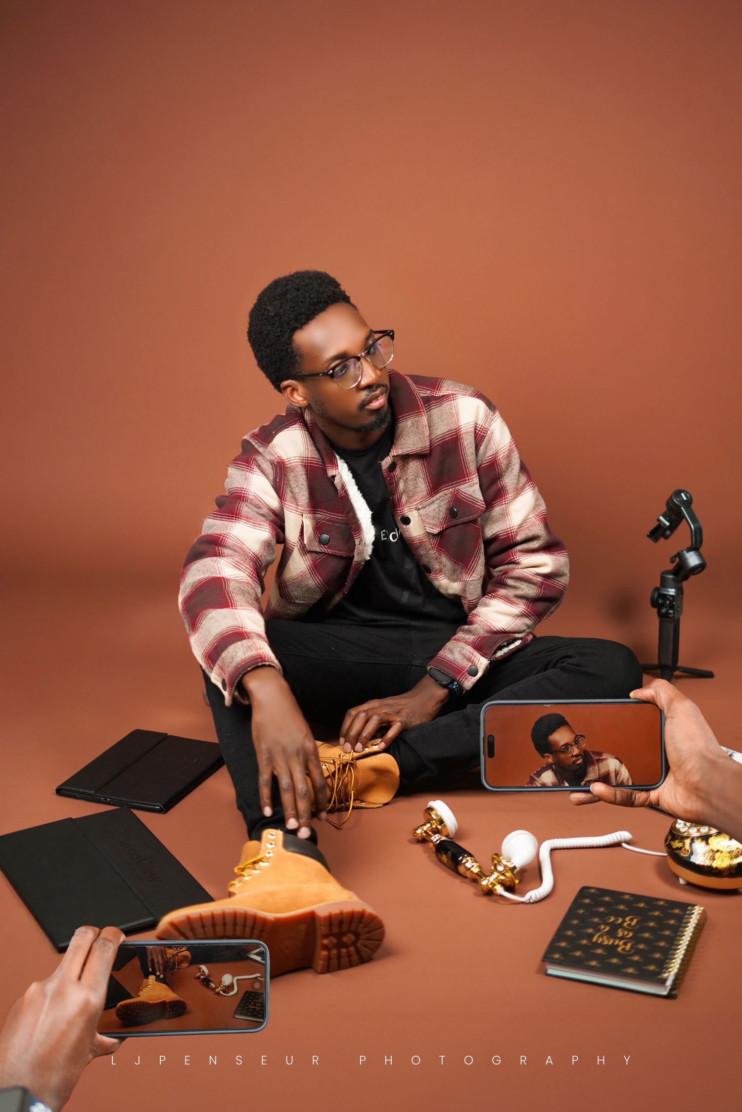 Lifestyle product photography series showing hands interacting with vintage cameras and books on warm brown backdrop.