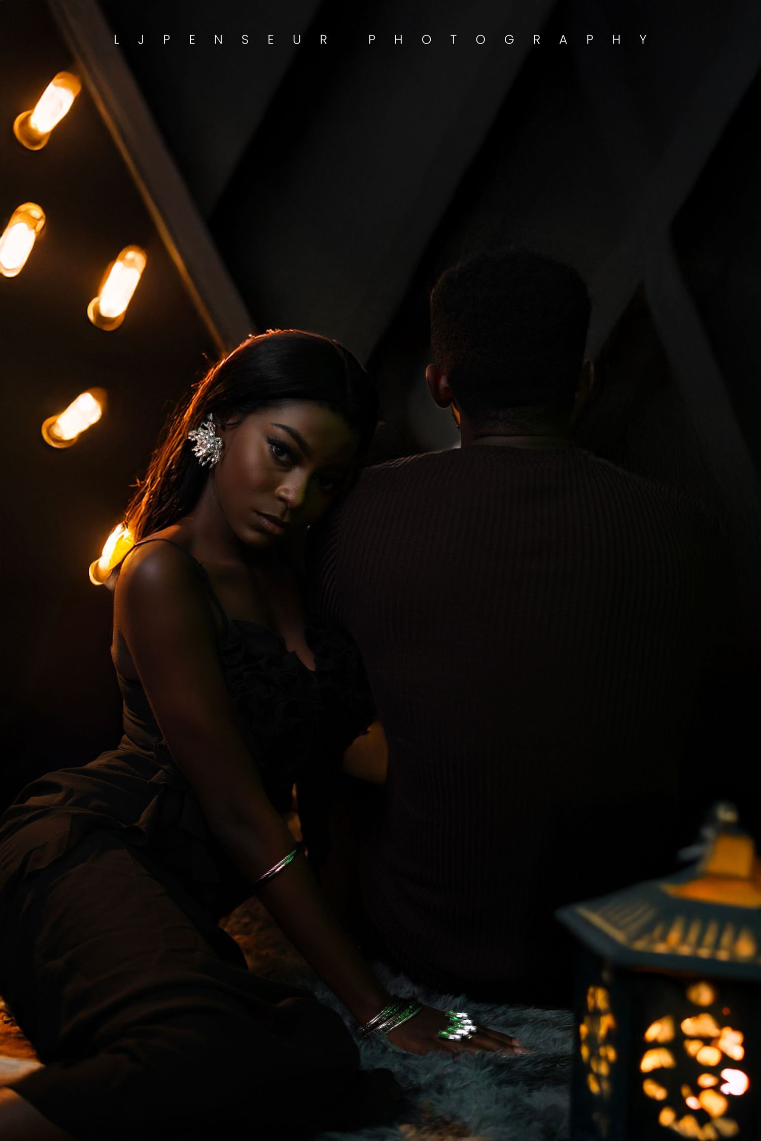 Moody low-light photography with warm ambient lighting creating dramatic shadows.
