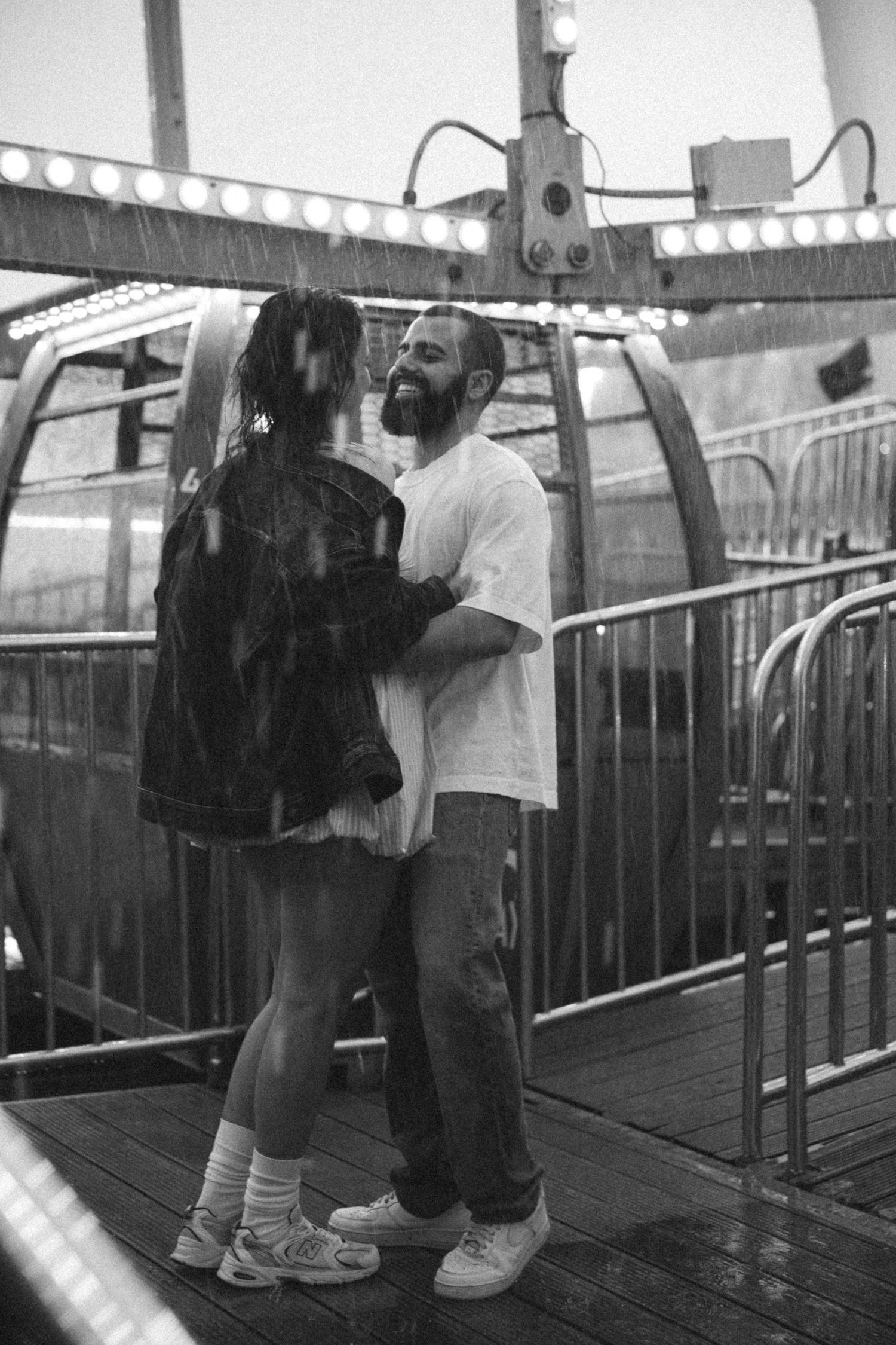Black and white photos showing playful interactions between two people at a carnival.