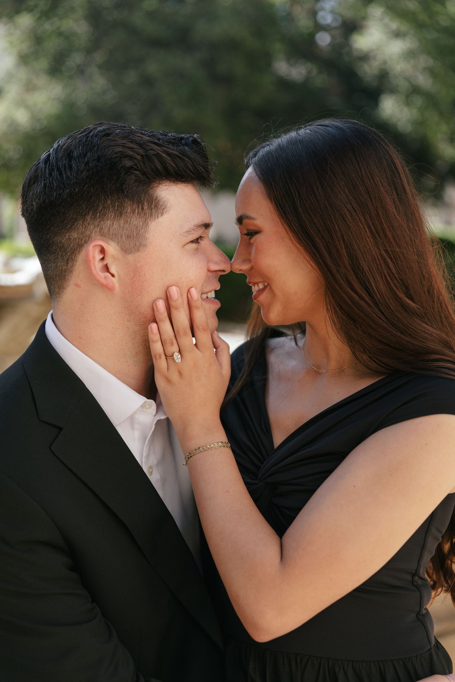 A tender moment between a couple in formal wear sharing a close embrace.