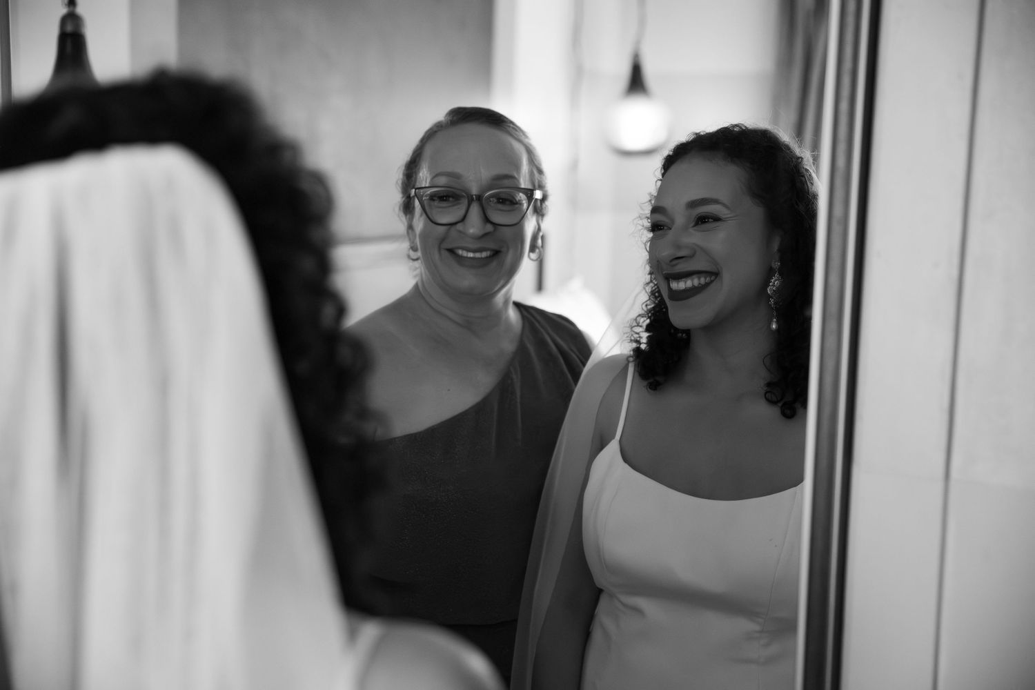 A black and white photo collage showing candid moments and expressions at what appears to be a social gathering.