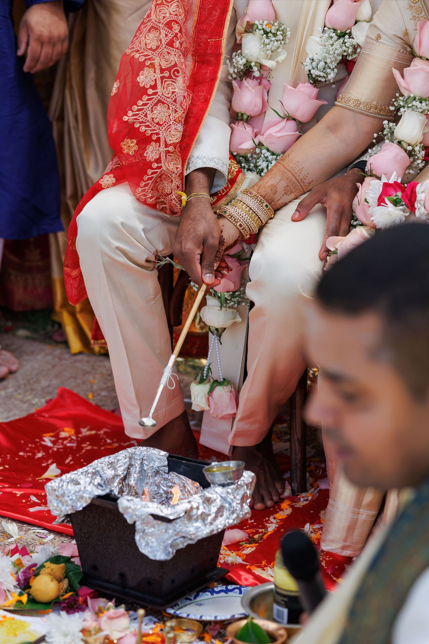 Hindu wedding ritual with sacred fire havan kund, couple performing traditional marriage ceremonies.