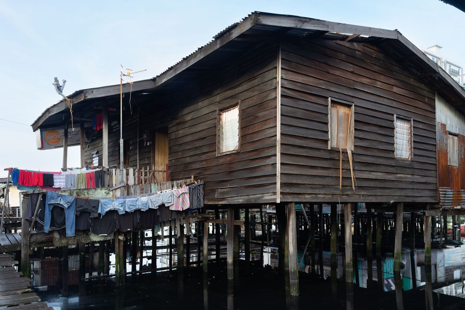 A wooden house that remains strong and well-preserved in Kampung Sembulan. Kota Kinabalu, Sabah, Malaysia. February 11, 2023.