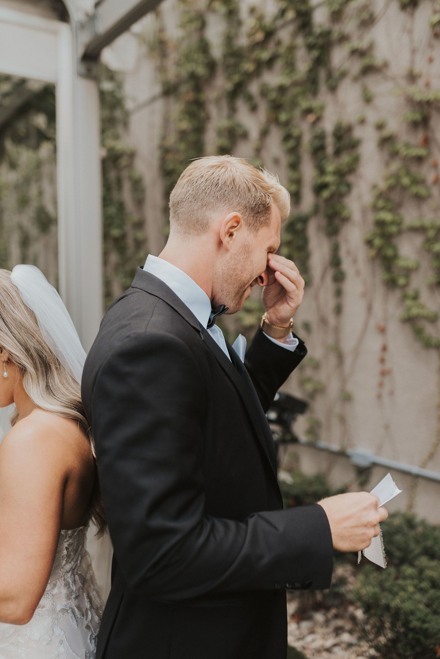 Emotional first look sequence between couple during outdoor wedding ceremony.
