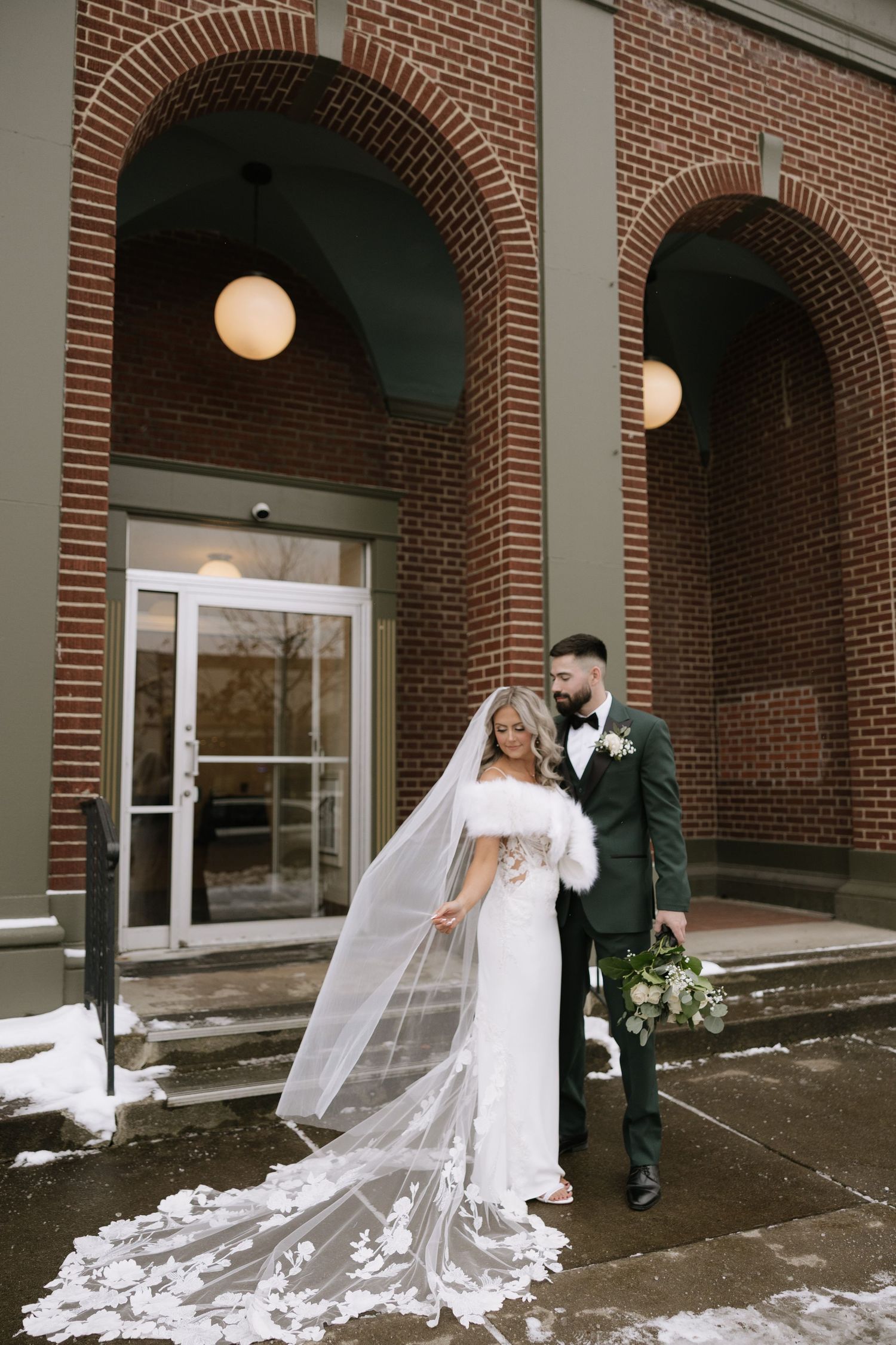 A romantic wedding sequence showing a couple in white and dark attire sharing intimate moments under brick archways.