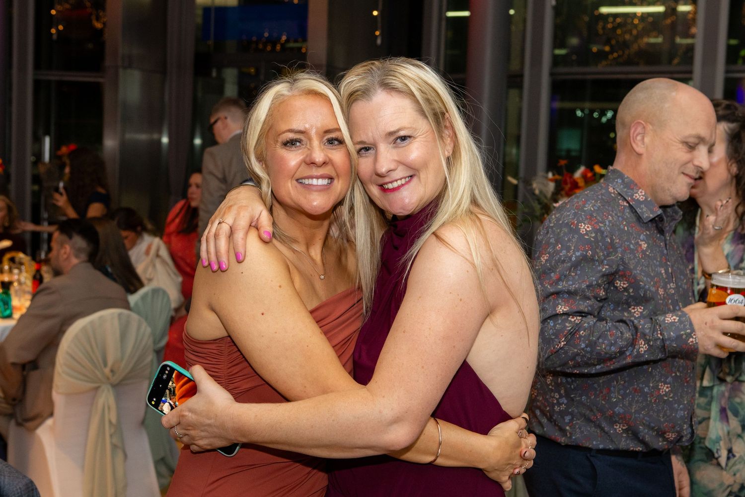 A series of candid party photos showing people dancing and embracing at what appears to be a social gathering or celebration.