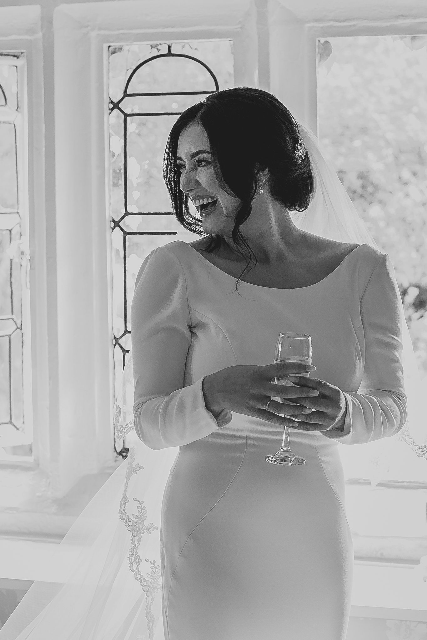 Wedding preparation scene with elegant white dress details.