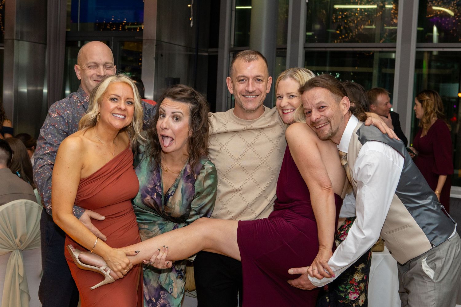 A collage of people dancing and celebrating at what appears to be a wedding reception or party.