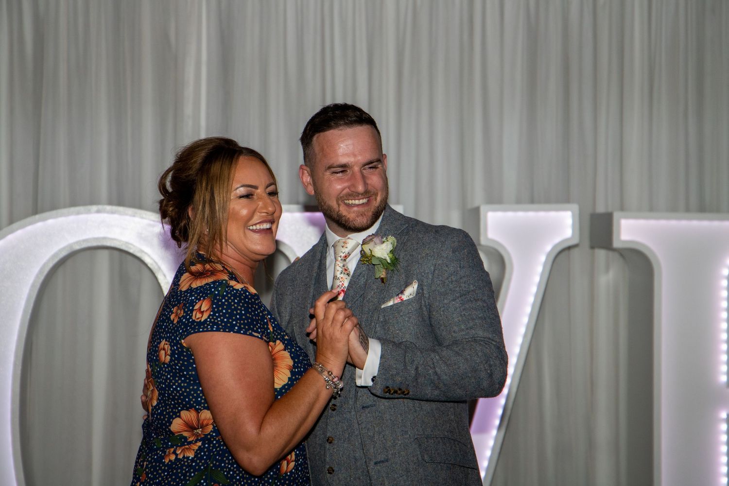 Wedding couple shares an intimate dance moment at their reception.