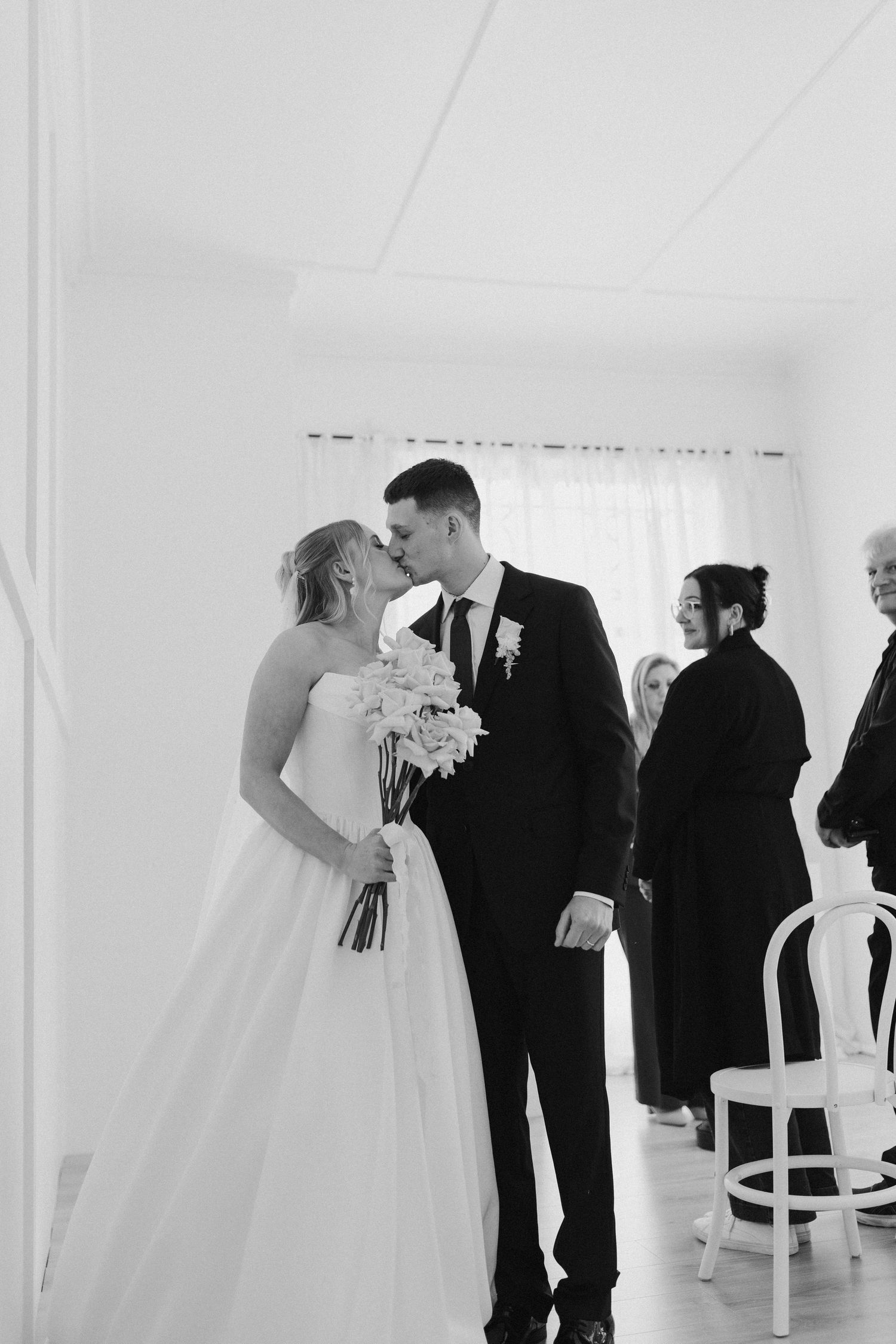 Couple kissing at their intimate wedding ceremony