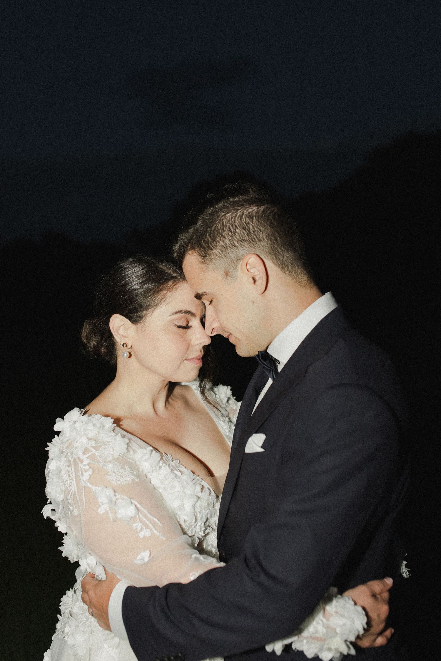 Bride and groom with foreheads together for Auckland wedding portraits