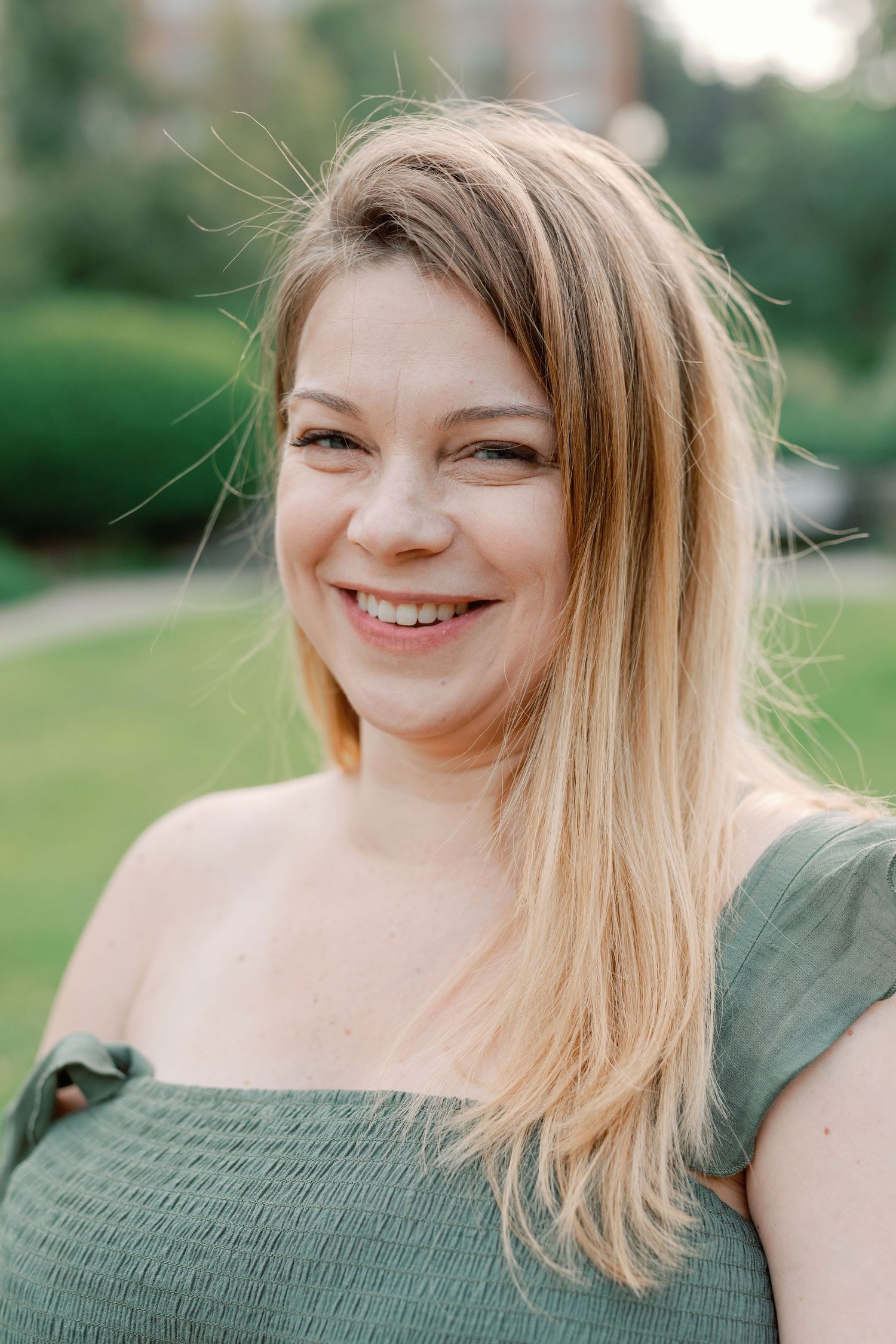 Portrait series showing joyful expressions in an olive green summer top.