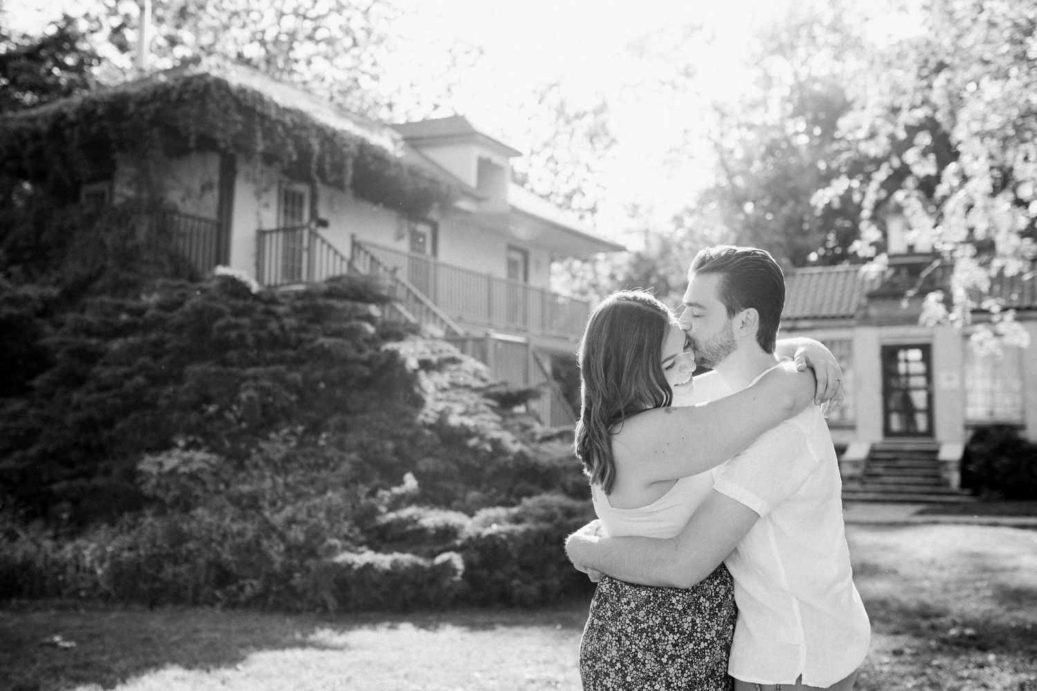 Joyful moment of couple embracing each other at Adamson Estate in beautiful light - Katie Crane Photography, Toronto Can