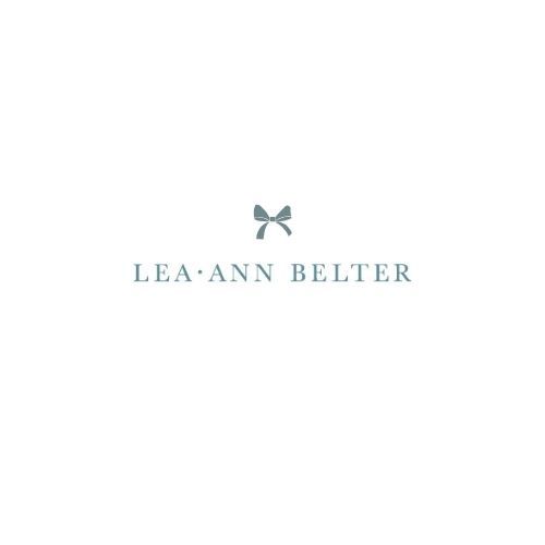 Classic wedding photographer branding with delicate bow icon.