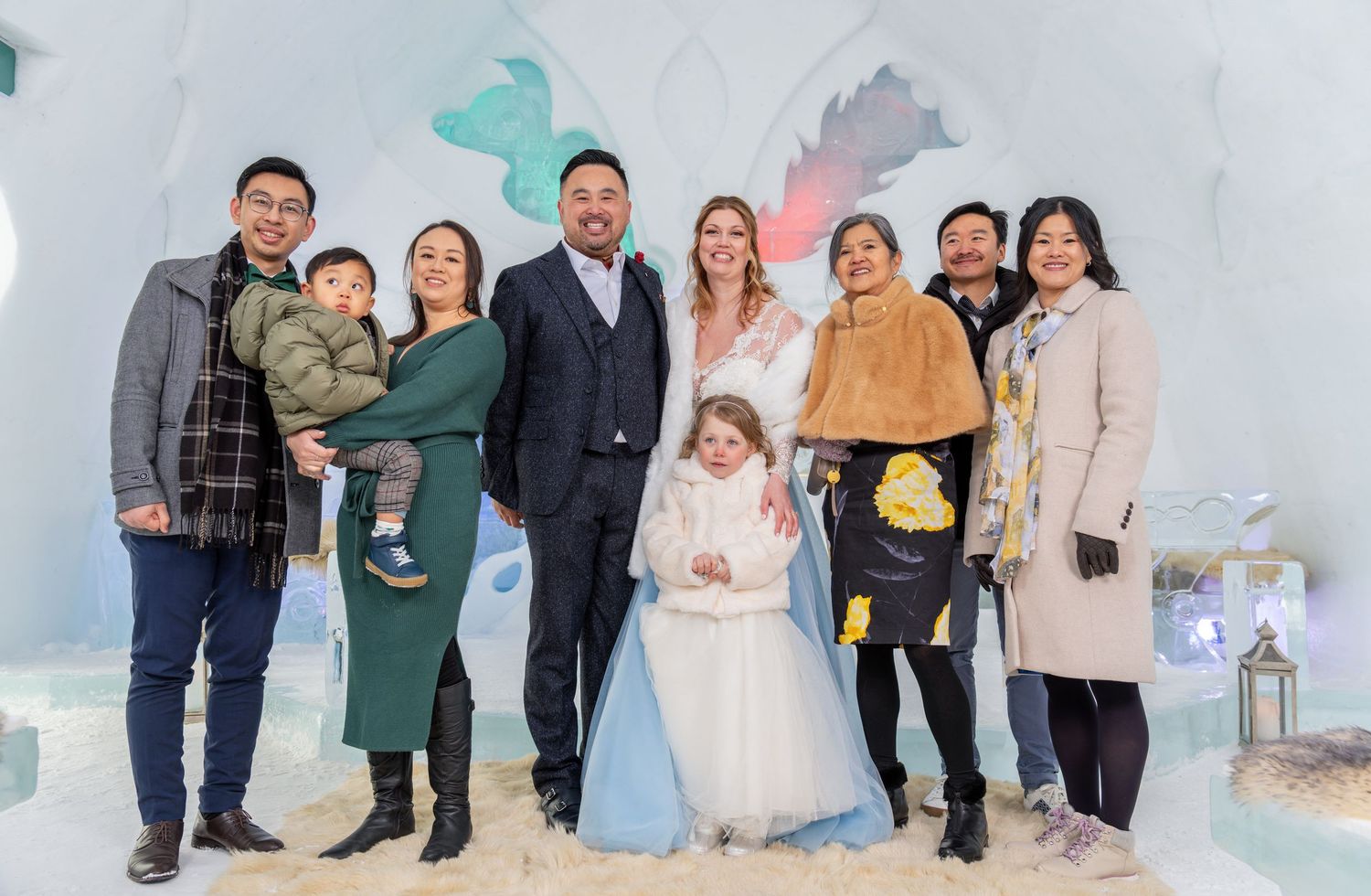 Joyful family and wedding party group portrait during a Quebec wedding celebration
