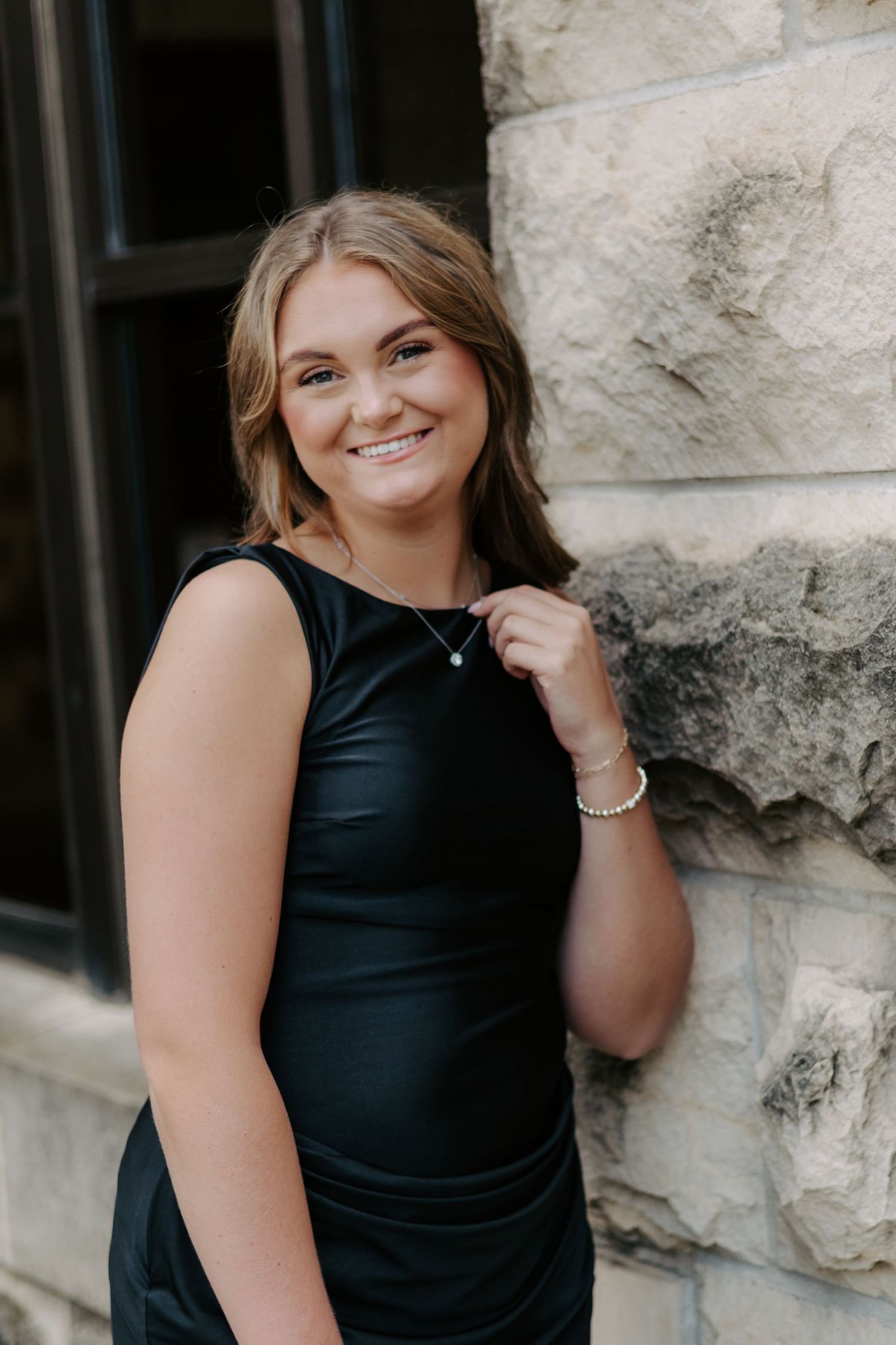 College senior portrait celebrating graduation in Manhattan, Kansas.