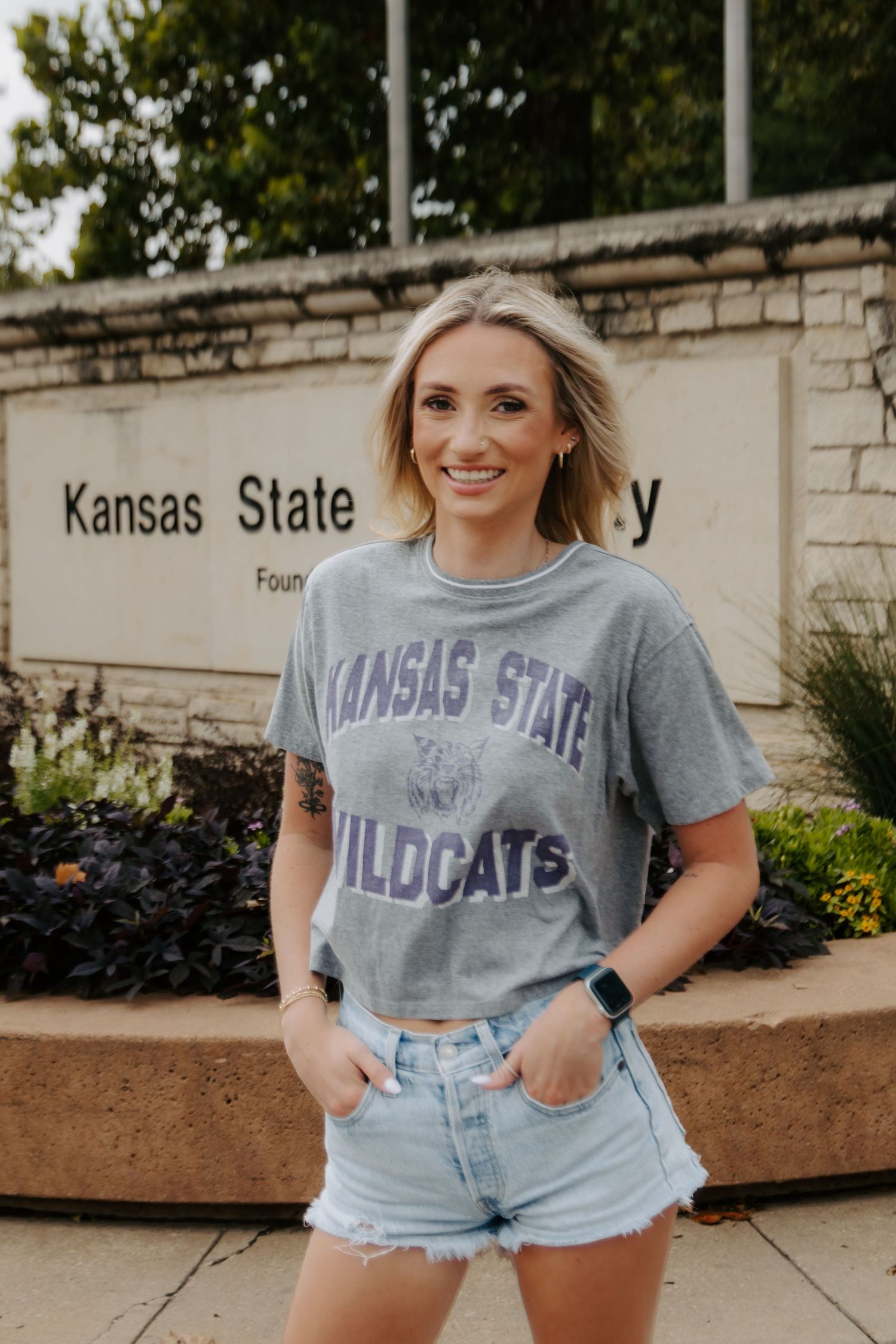 College senior portrait celebrating graduation in Manhattan, Kansas.