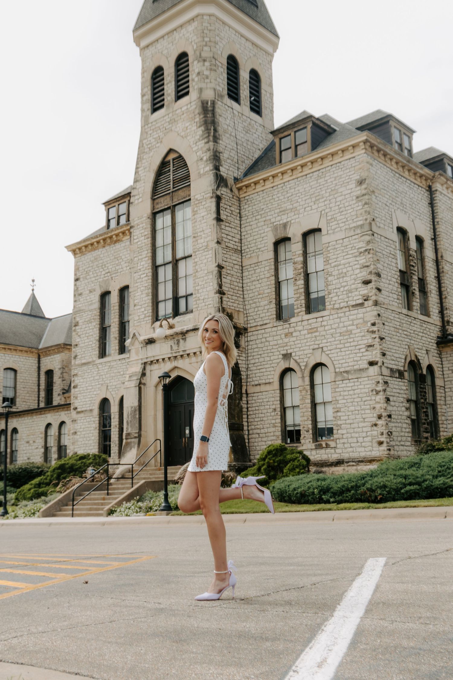 College senior portrait celebrating graduation in Manhattan, Kansas.
