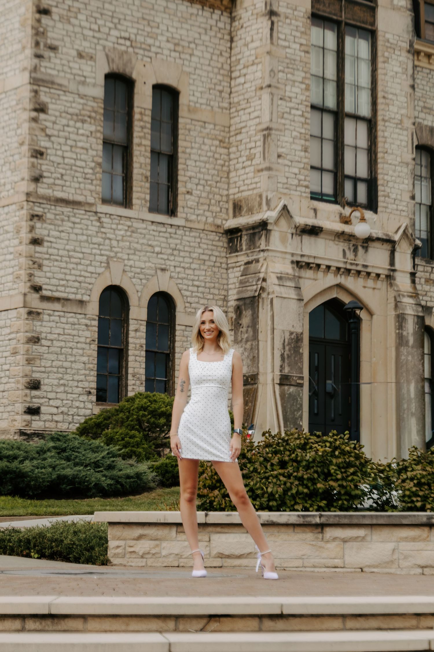 College senior portrait celebrating graduation in Manhattan, Kansas.