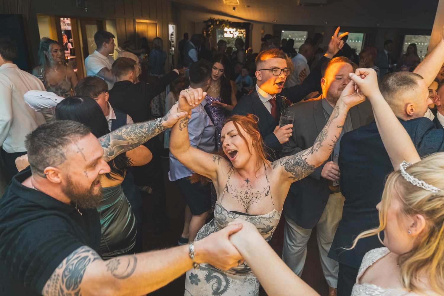 the bride and wedding guests dancing at Aston Hall hotel wedding venue