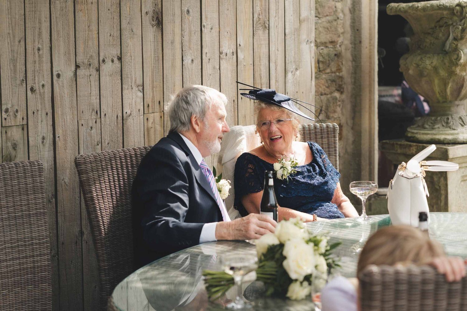 a couple talking candidly at a wedding reception in lancashire