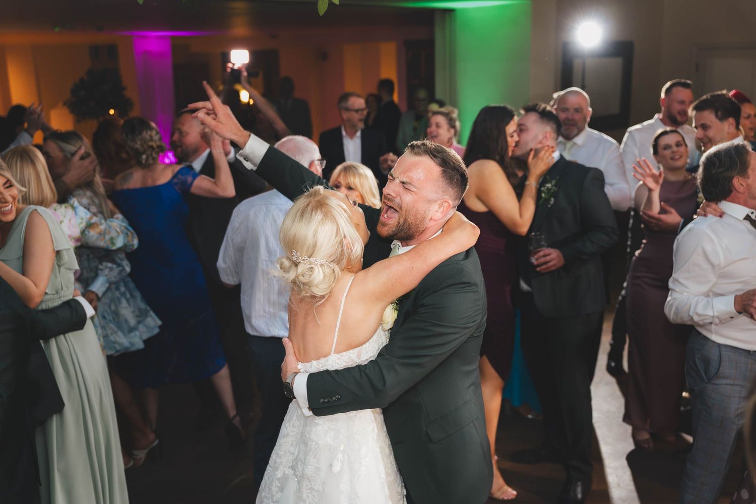 a bride and groom dance at their wedding reception in ribble valley