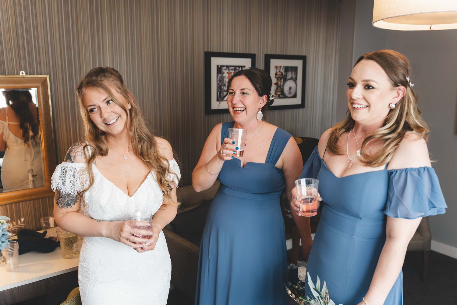 a bridal party smile naturally at Brockholes near Preston