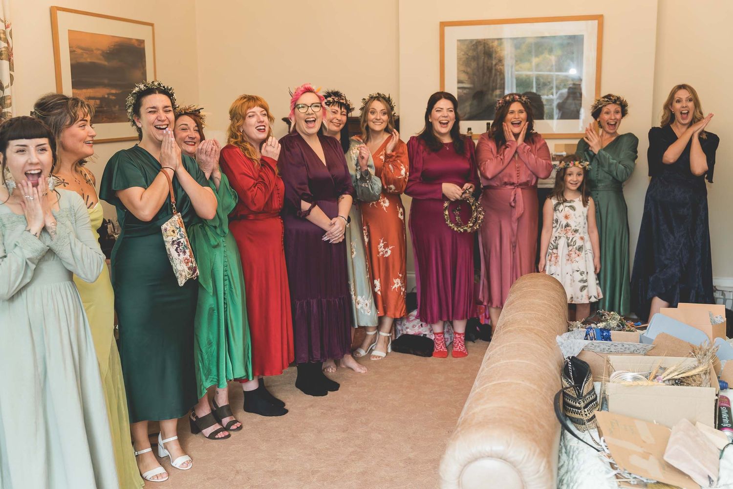 a group of bridesmaids smiling and crying at a wedding in Durham