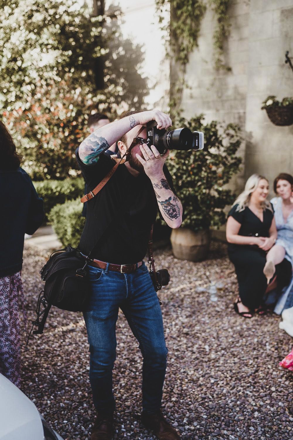 A wedding photographer taking photos at Falcon Manor in Settle, North Yorkshire