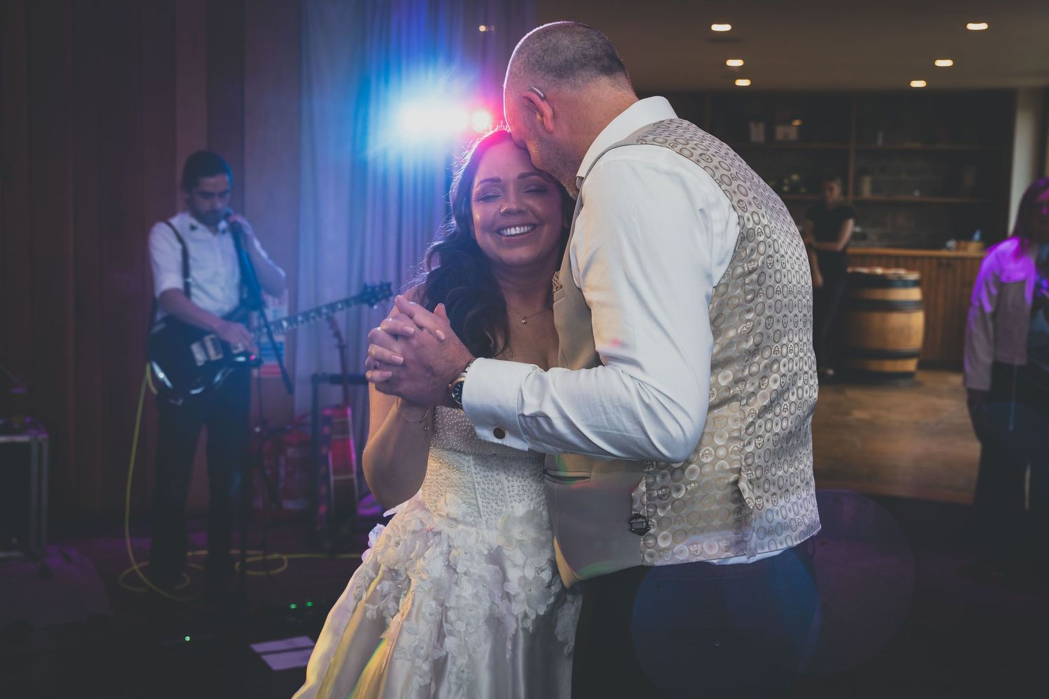 a bride and groom on the dance floor at their wedding in ribble valley