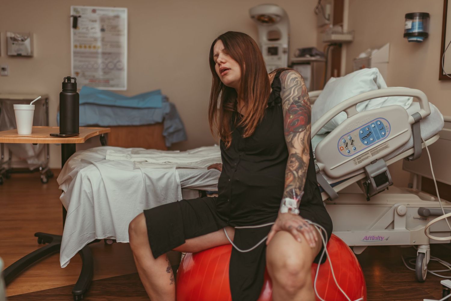 Virginia Beach mom actively laboring on a labor ball in a local hospital.