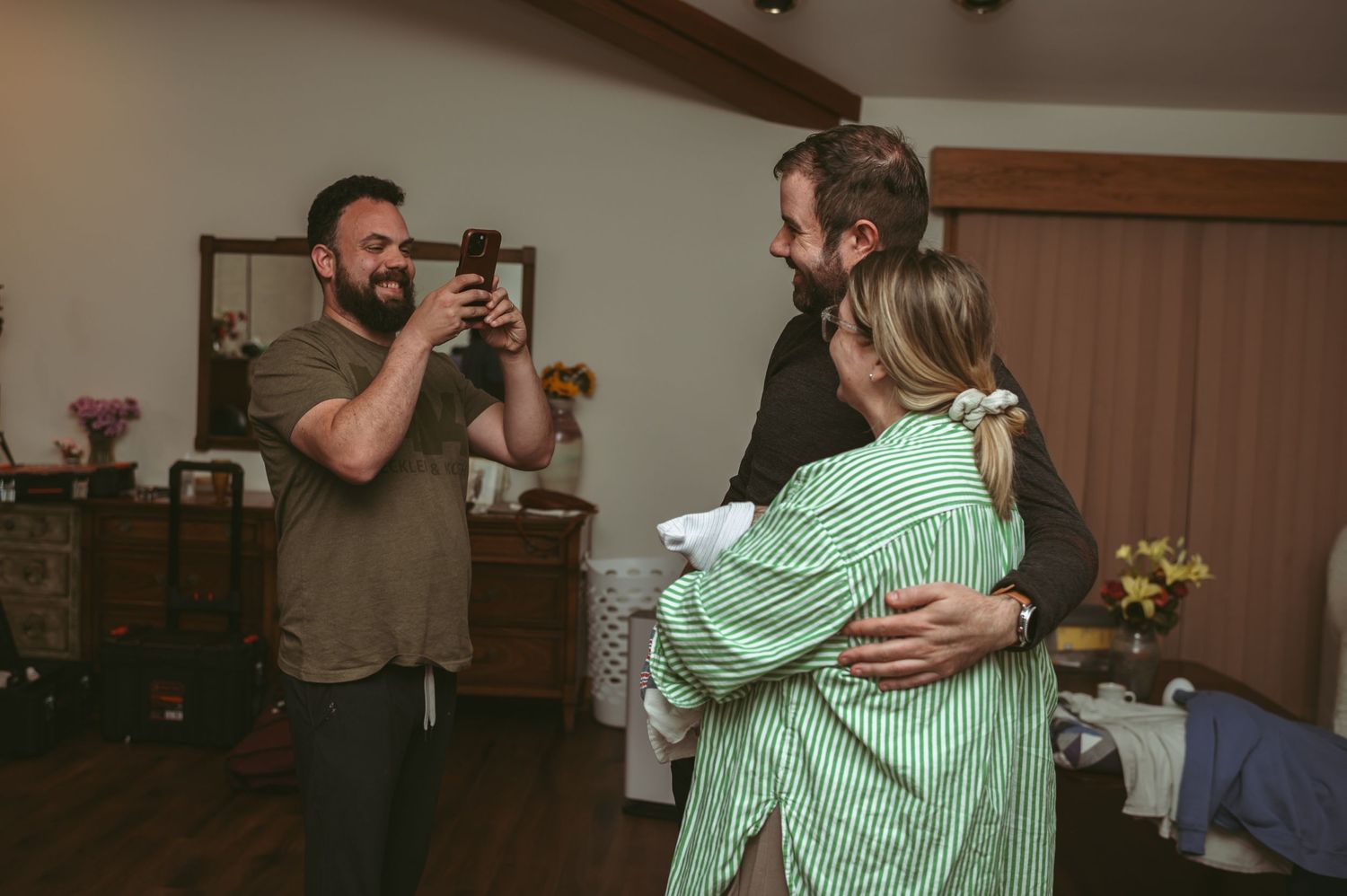 Brother in-law taking a photo of the happy couple after his wife gave birth to their son in their Virginia home.